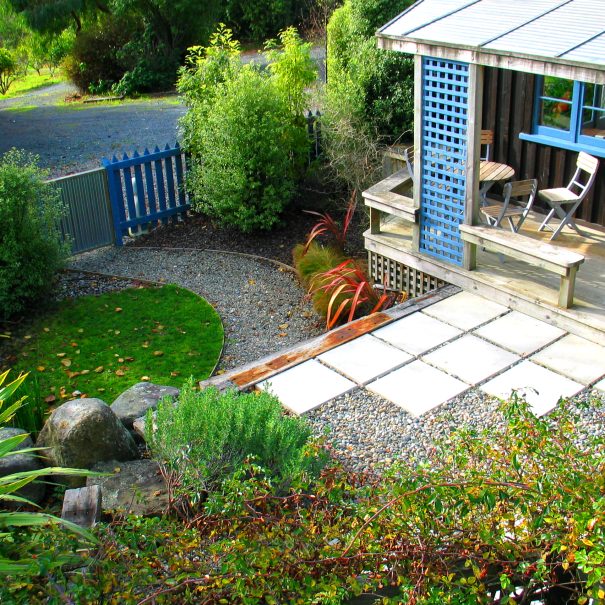 Private fenced courtyard and orchards and field beyond